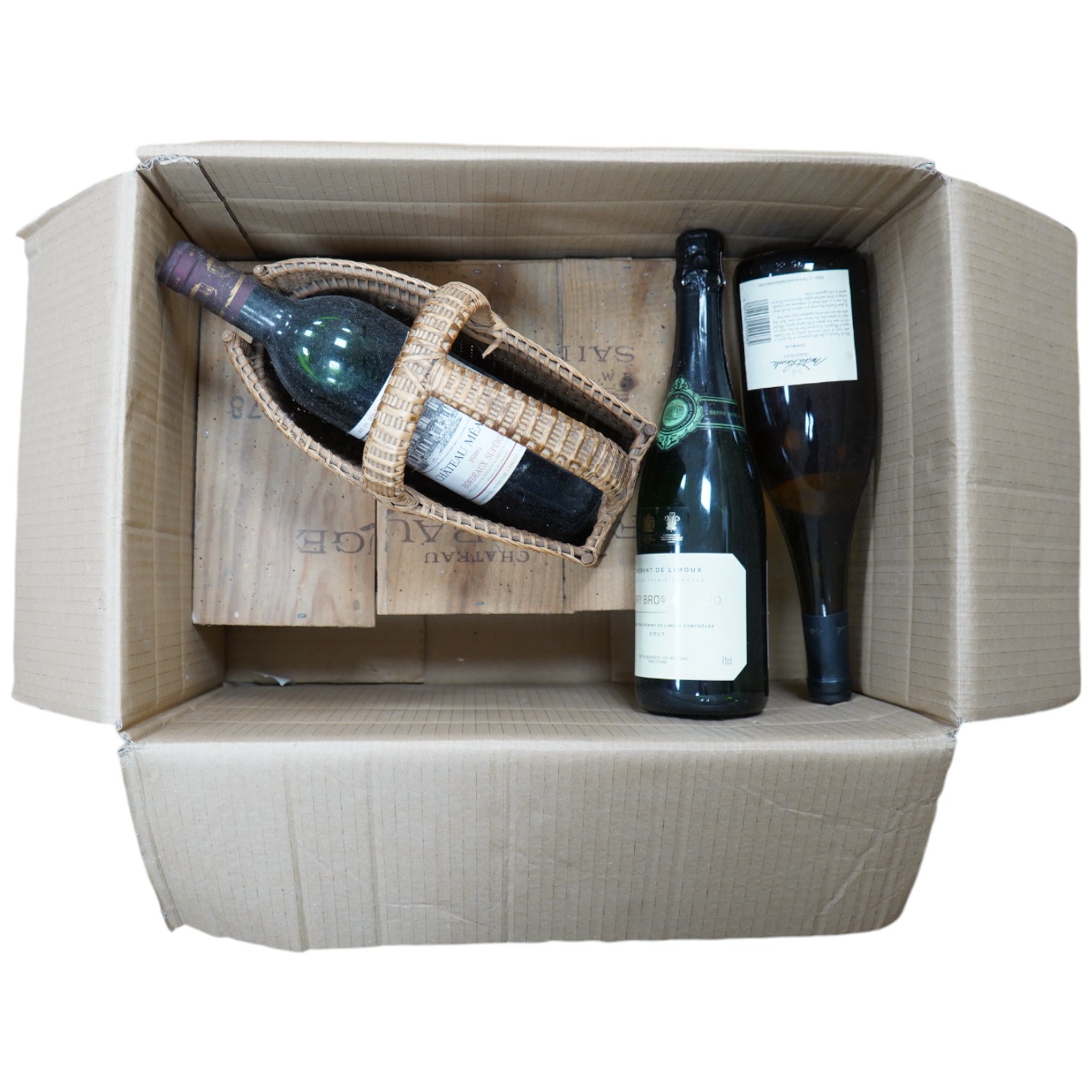 Two large bottles of Chateau Fombrange in wooden crate and three other bottles. Condition - fair, storage unknown